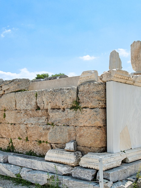 Ancient stone structure at Bema of Saint Paul, Greece, under a clear blue sky.