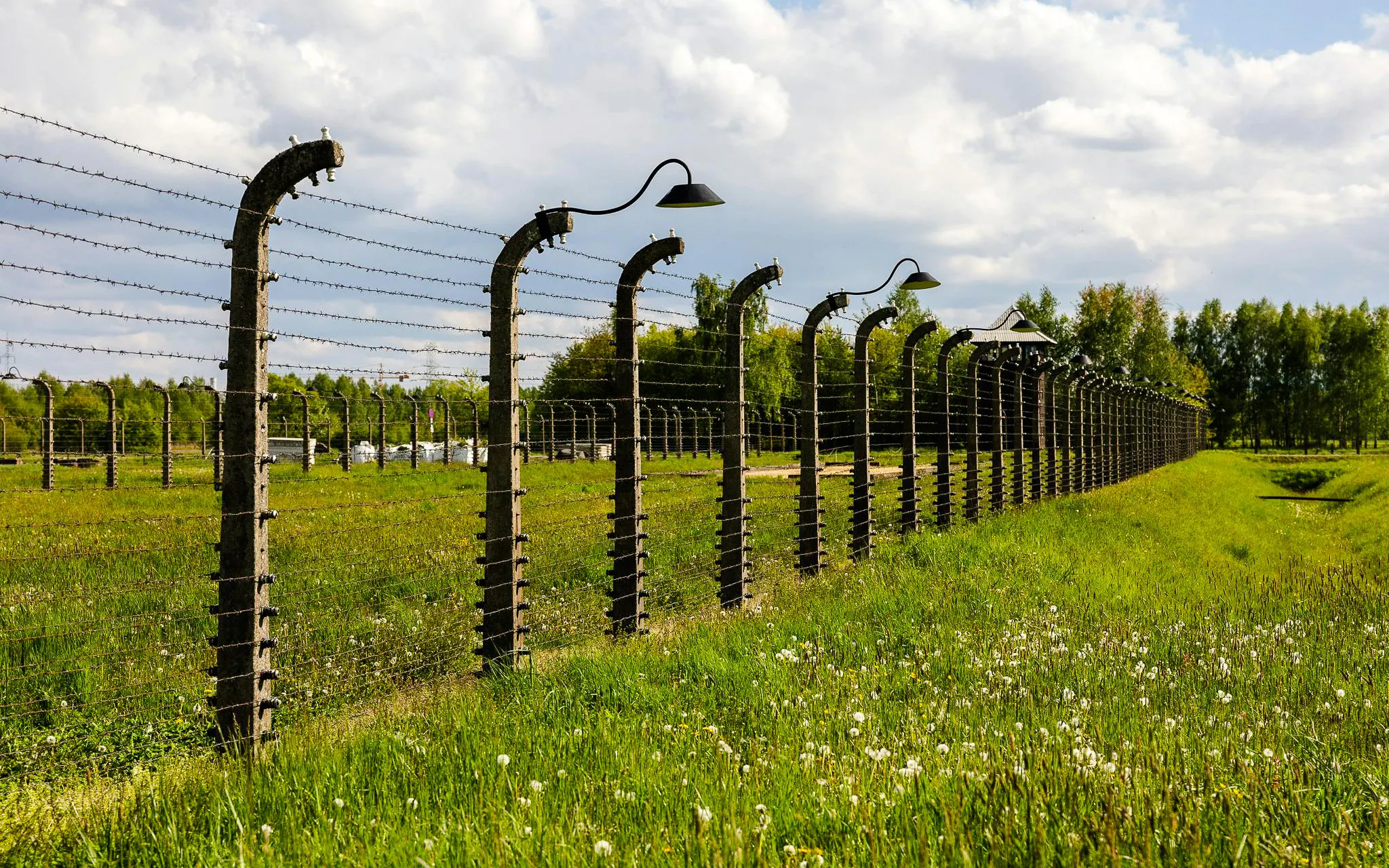 Barbed wire fence at Auschwitz-Birkenau concentration camp, Poland.