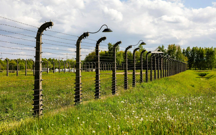 Barbed wire fence at Auschwitz-Birkenau concentration camp, Poland.
