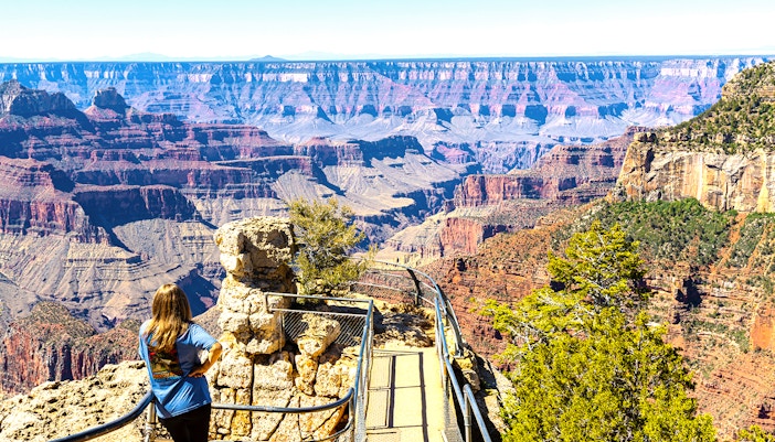 Hikers on Bright Angel Trail, Grand Canyon National Park, Arizona, with canyon views.