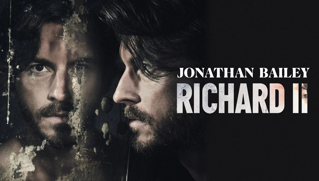 Actor in Richard II promotional poster with reflective surface.