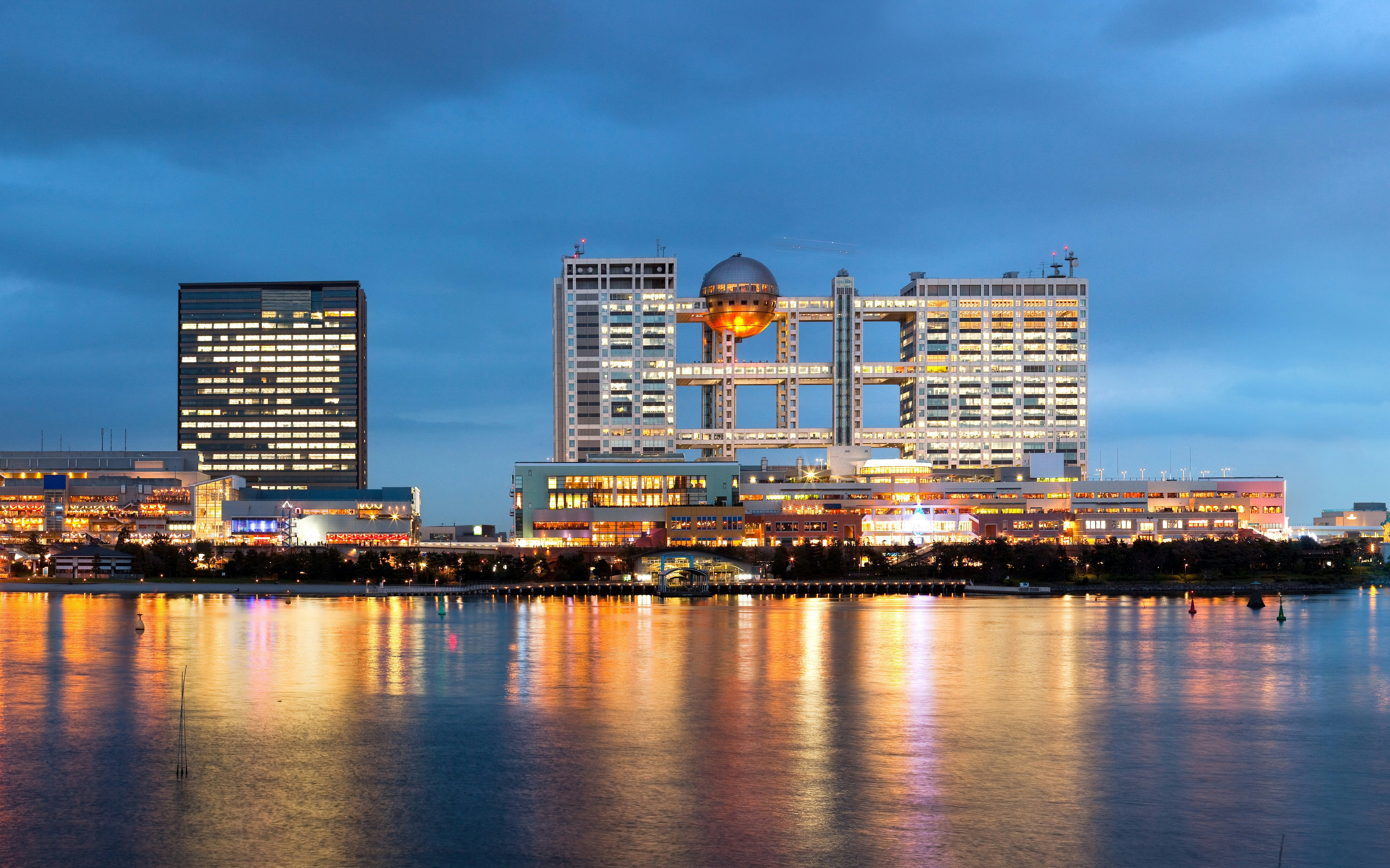 Skyline of Odaiba island with illuminated buildings at night, Tokyo, Japan.