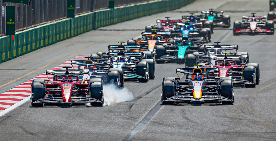 Formula 1 cars racing at Azerbaijan Grand Prix in Baku.