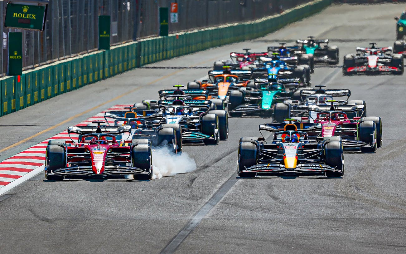 Formula 1 cars racing at Azerbaijan Grand Prix in Baku.