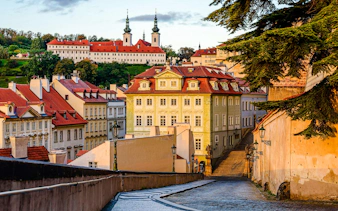 Ke Hradu staircase leading to Prague Castle, surrounded by historic buildings in Prague, Czech Republic.