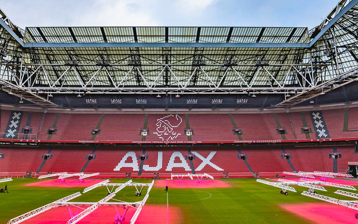 Johan Cruijff Arena interior with Ajax logo on seats, Amsterdam.