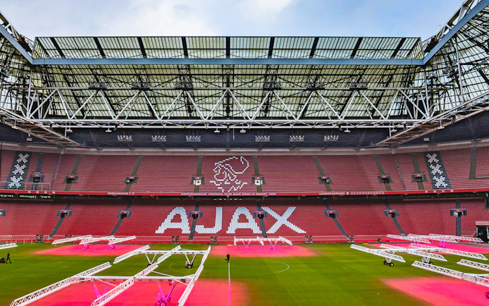 Johan Cruijff Arena interior with Ajax logo on seats, Amsterdam.