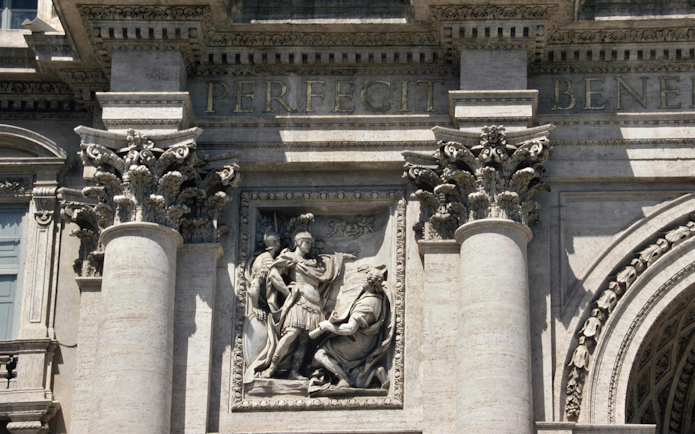 Sculptural detail of Trevi Fountain in Rome, Italy, featuring Roman figures.