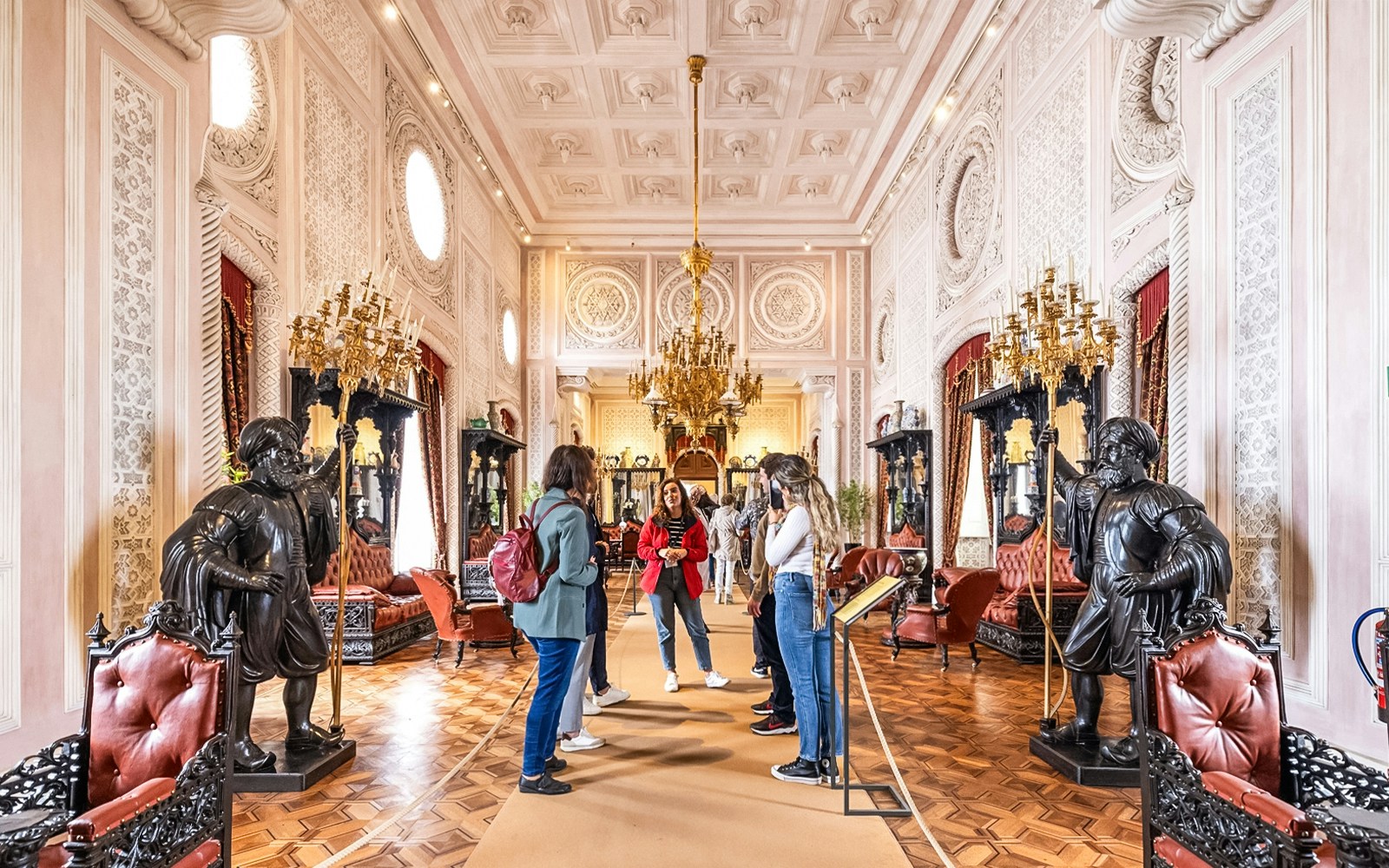 tourists exploring interiors of pena palace during a guided tour