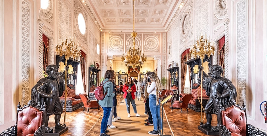 Visitors exploring ornate interior during Pena Palace guided tour.