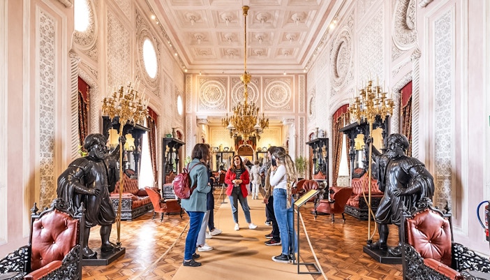 Visitors exploring ornate interior during Pena Palace guided tour.
