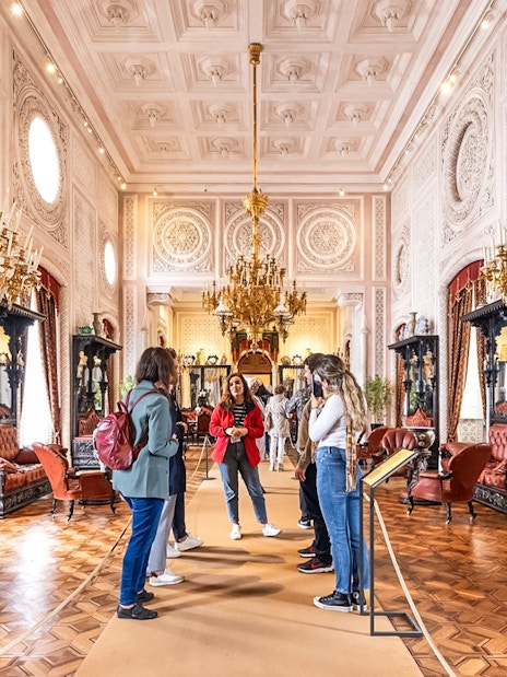 Visitors exploring ornate interior during Pena Palace guided tour.