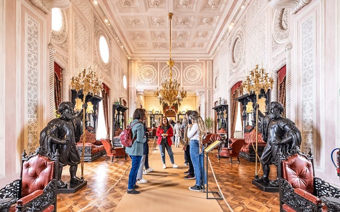 Visitors exploring ornate interior during Pena Palace guided tour.