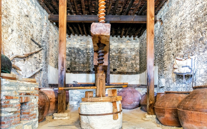 Old wine press in a stone building in Omodos, Cyprus.