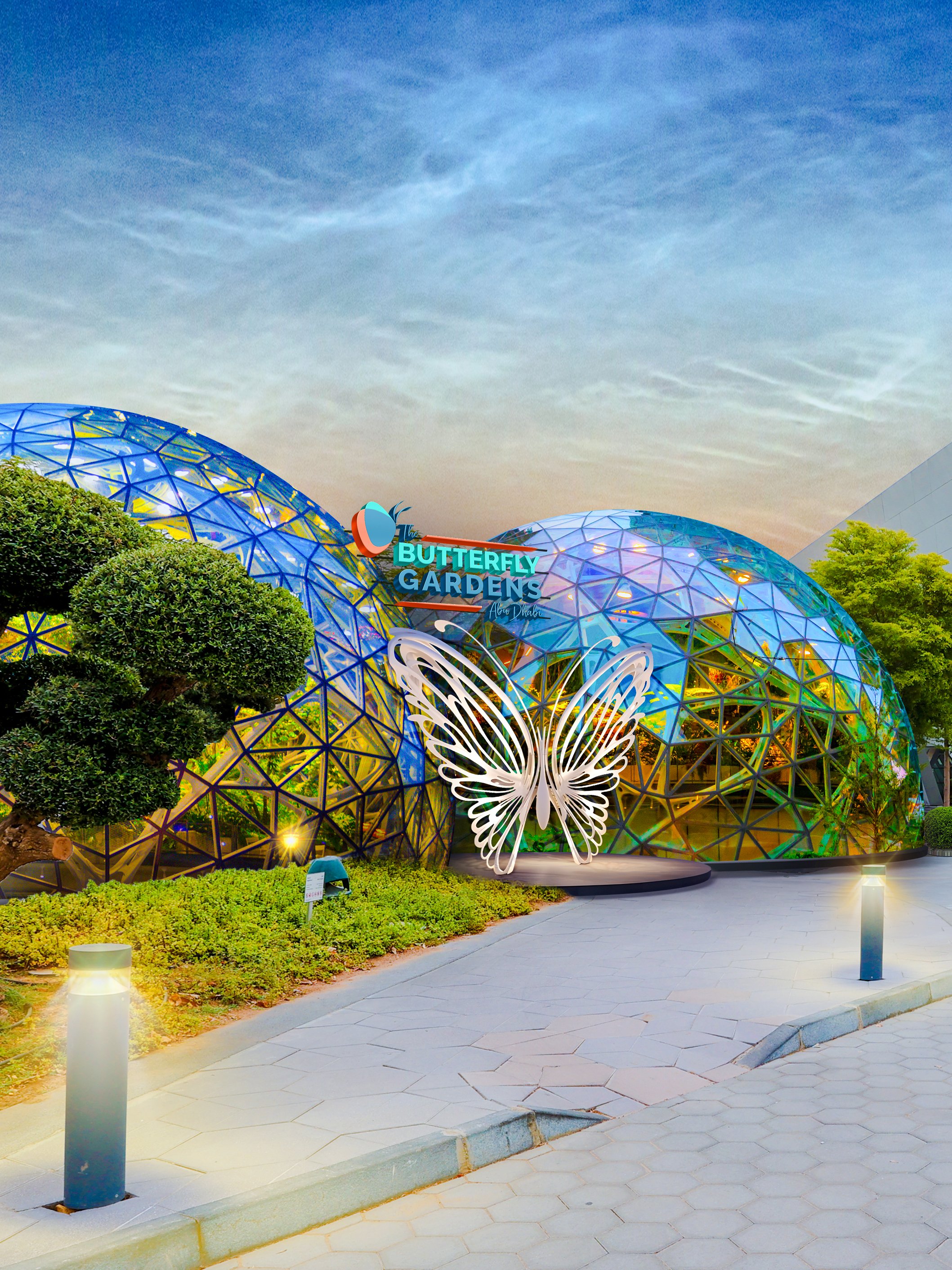 Butterfly Gardens entrance with geometric dome and illuminated butterfly sculpture.