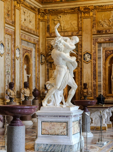 Sculpture in ornate room at Borghese Gallery, Rome.