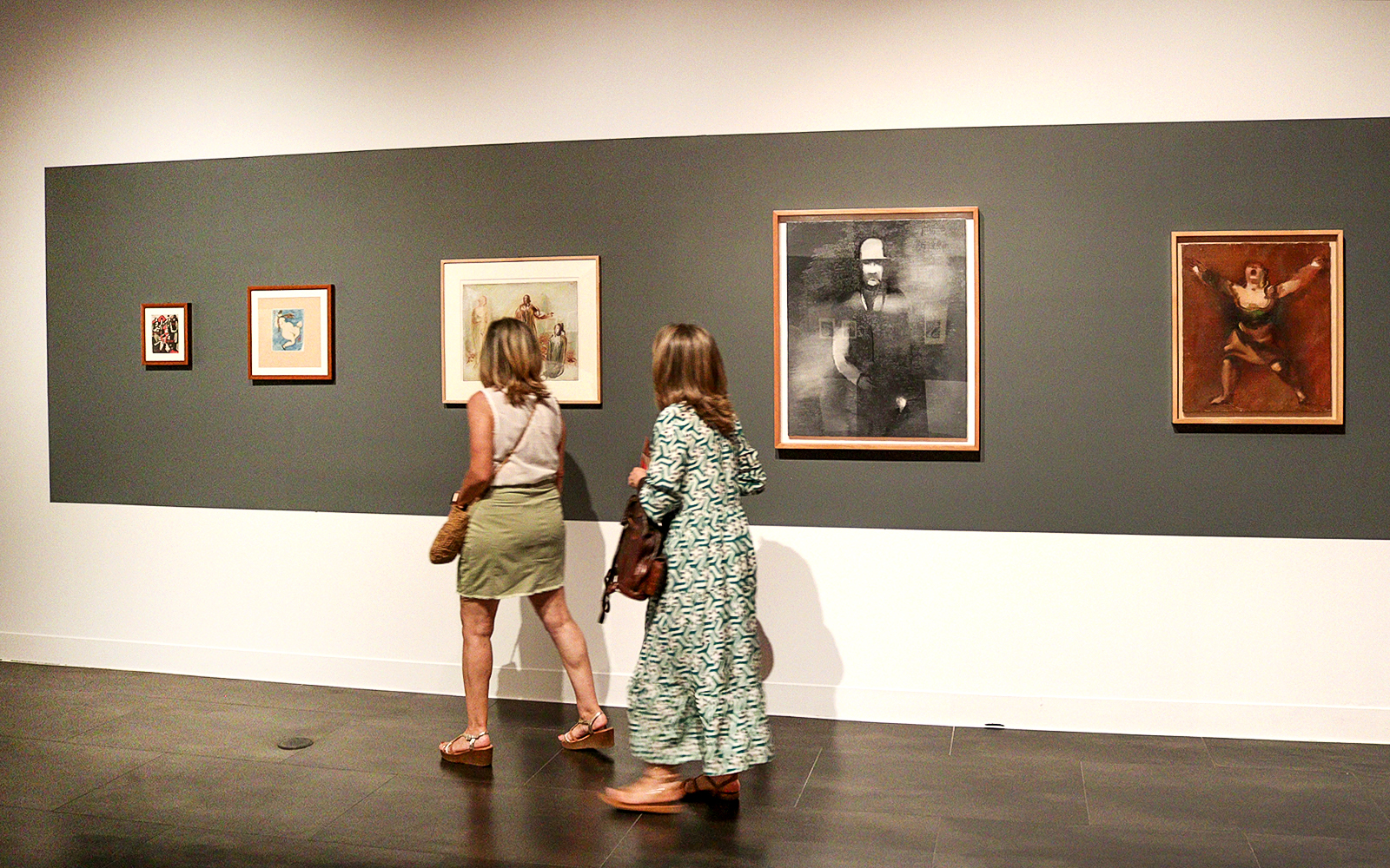 Visitors viewing artwork at the Russian Museum exhibition.