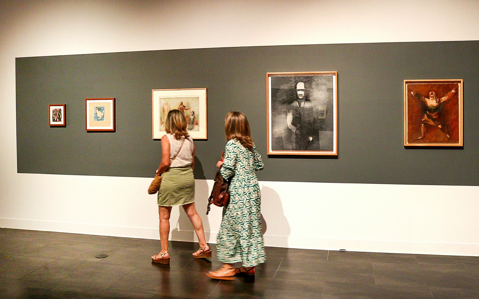 Visitors viewing artwork at the Russian Museum exhibition.