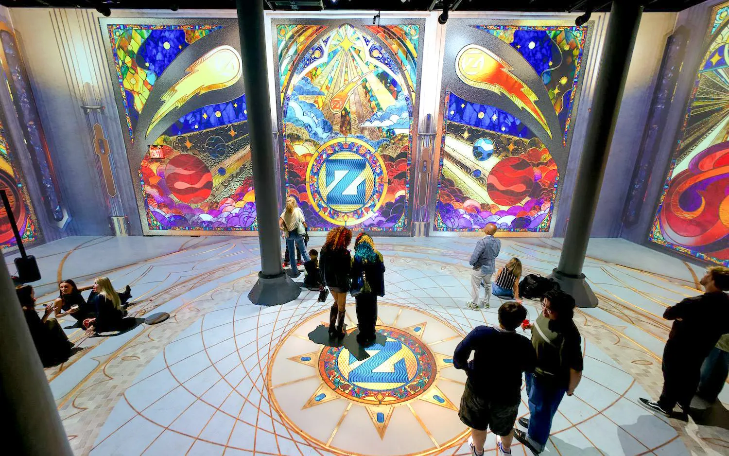 Guests viewing vibrant digital art installations at ARTECHOUSE DC.