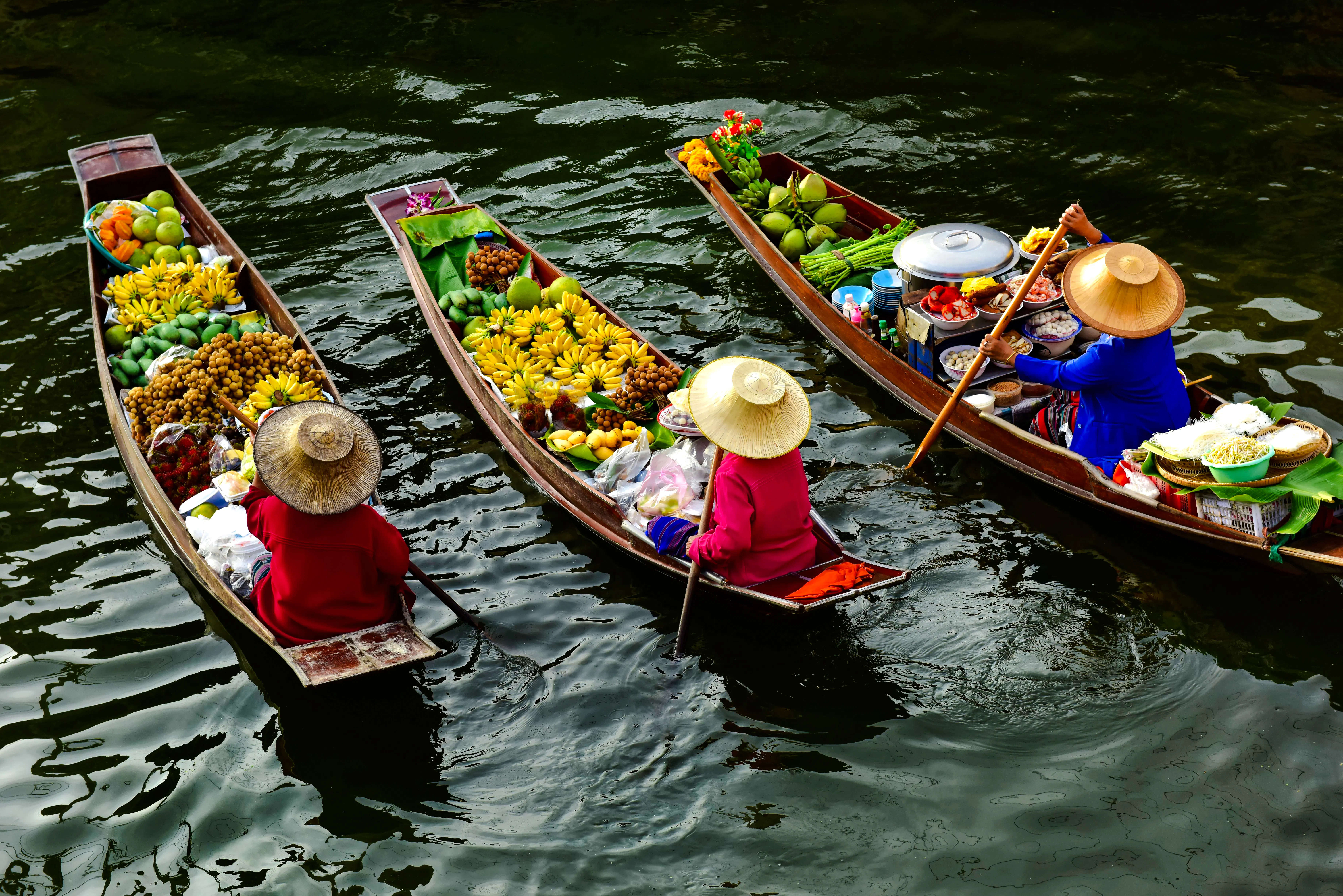 Floating market boats with fruits and goods, Pattaya city tour.