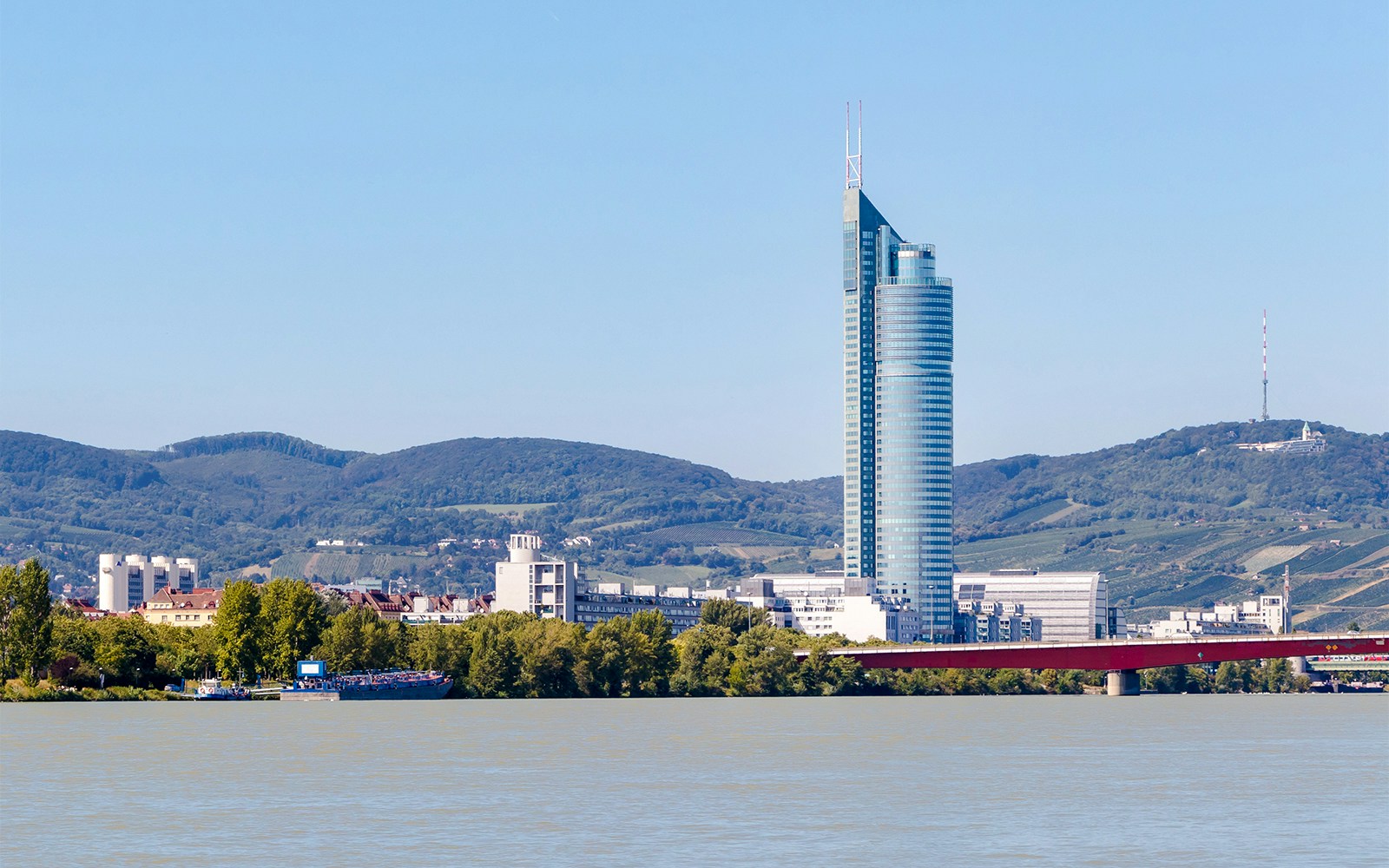 Danube River cruise with view of Millennium Tower in Vienna, Austria.