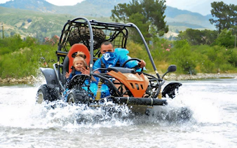Buggy crossing a stream during Alanya Buggy Safari tour in Turkey.