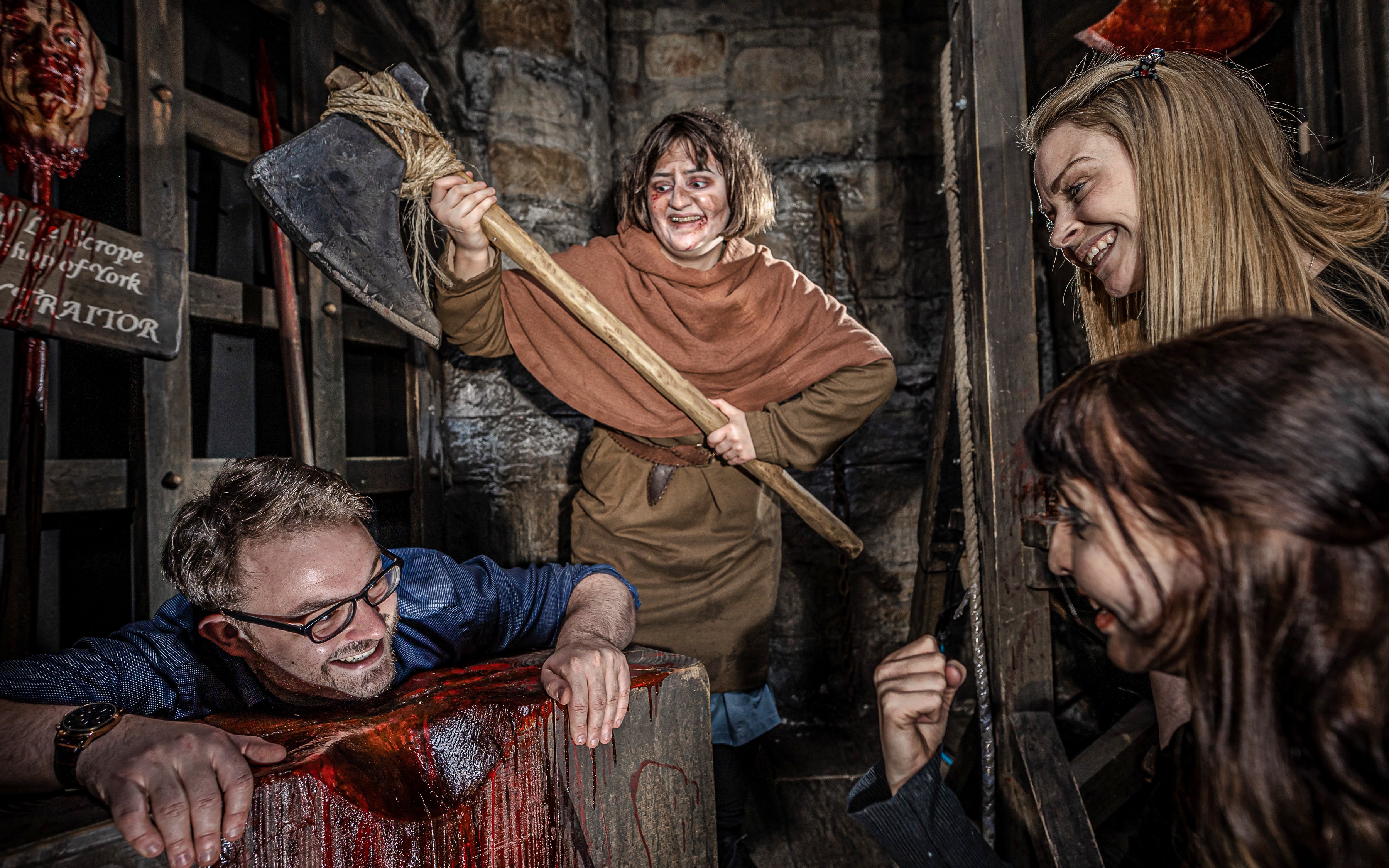 Executioner scene at York Dungeon with actors and visitors interacting.