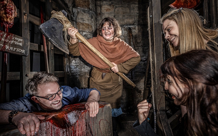 Executioner scene at York Dungeon with actors and visitors interacting.