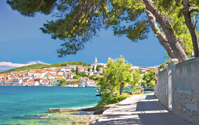 Kali village on Ugljan island with turquoise sea and walkway, Zadar archipelago.