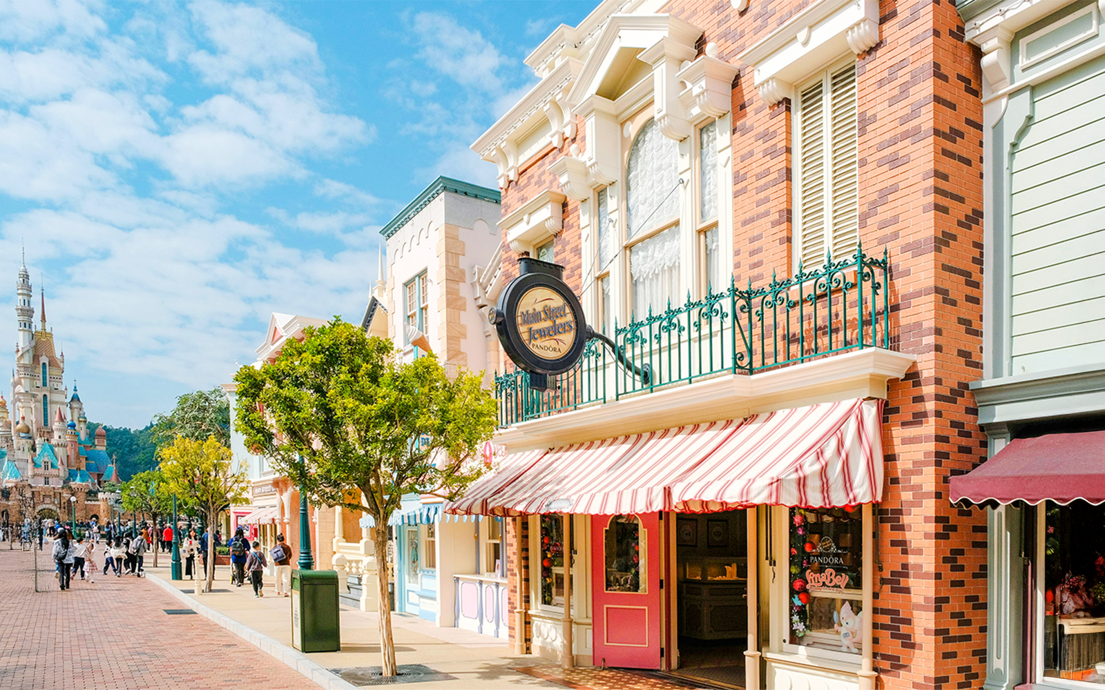 Main street with shops and castle in Disneyland Hong Kong.