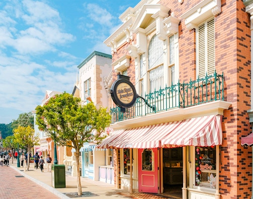 Main street with shops and castle in Disneyland Hong Kong.