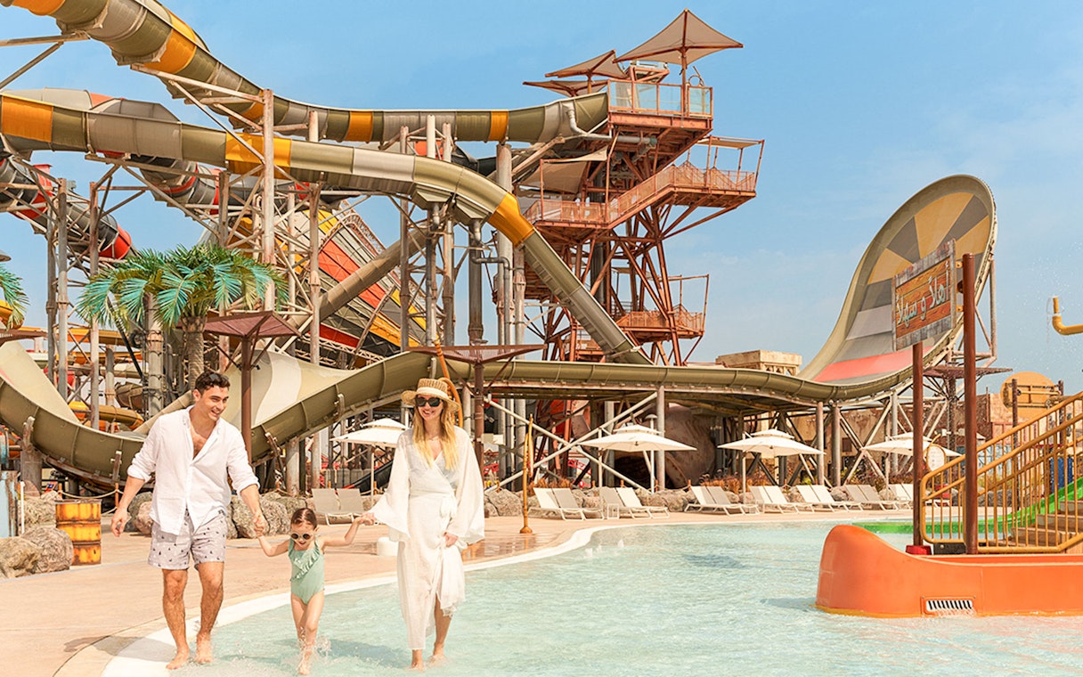 Family enjoying water rides at Meryal Waterpark.