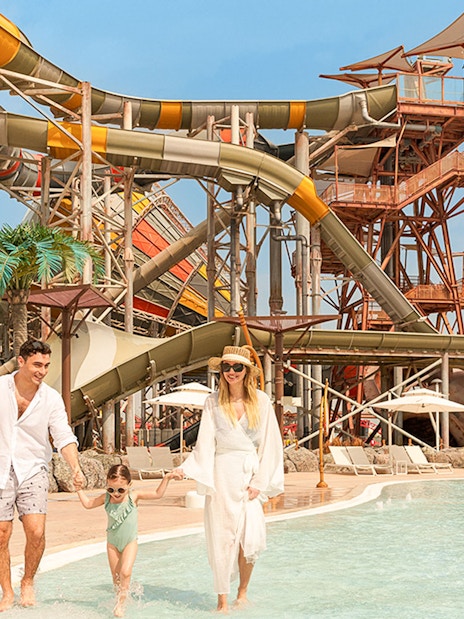 Family enjoying water rides at Meryal Waterpark.