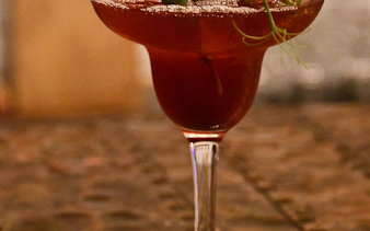 Icelandic cocktail with garnish in exclusive restaurant setting.