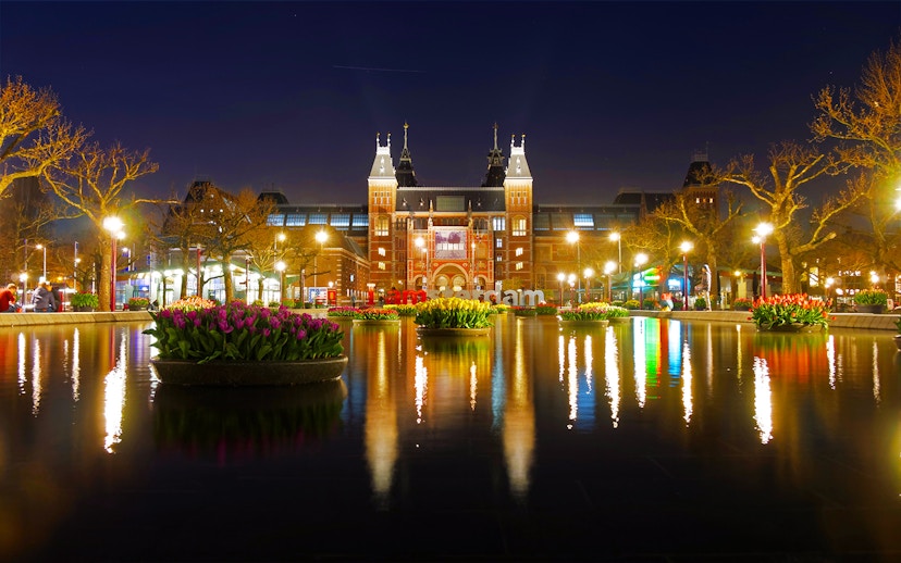 Rijksmuseum at night with tulip reflections in Amsterdam.