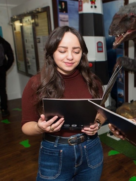 Visitors reading a Murder Mystery map at the National Wax Museum Plus.
