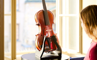 Violin display at Mozart Interactive Museum in Prague.