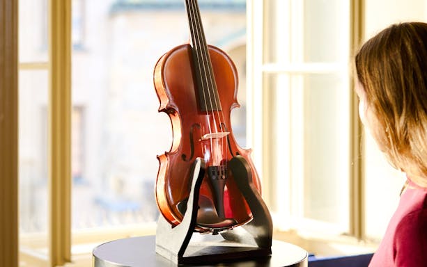 Violin display at Mozart Interactive Museum in Prague.