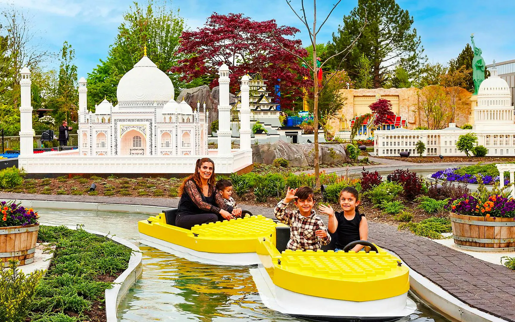 Miniboats navigating through Lego landmarks at Legoland Billund.