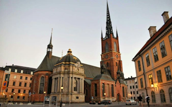 Riddarholmen Church in Stockholm at dusk, part of the Ghosts of Stockholm tour.