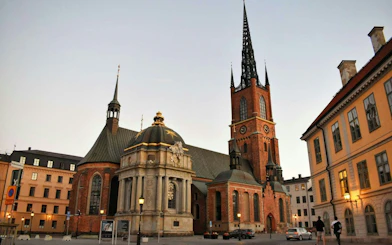 Riddarholmen Church in Stockholm at dusk, part of the Ghosts of Stockholm tour.