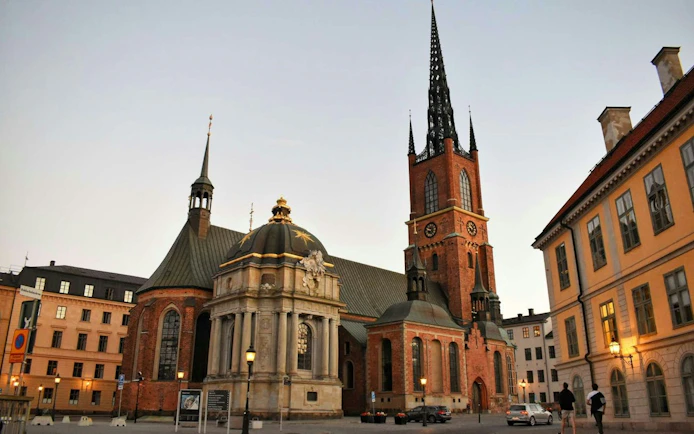 Riddarholmen Church in Stockholm at dusk, part of the Ghosts of Stockholm tour.