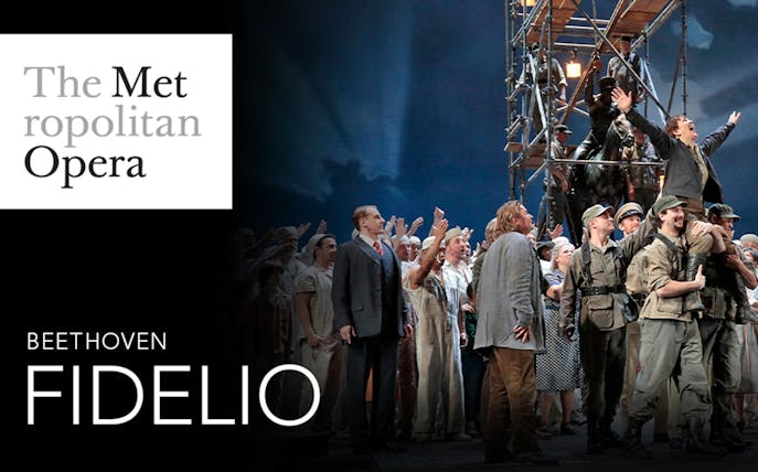 Metropolitan Opera performance of Beethoven's Fidelio with cast on stage.