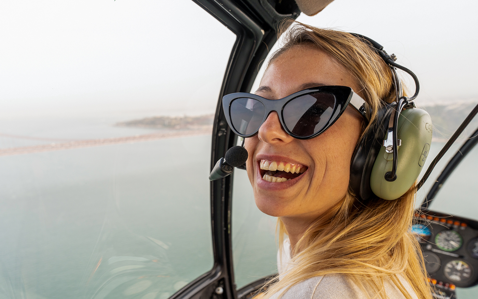 Helicopter passenger enjoying a flight over Lisbon’s coastline.