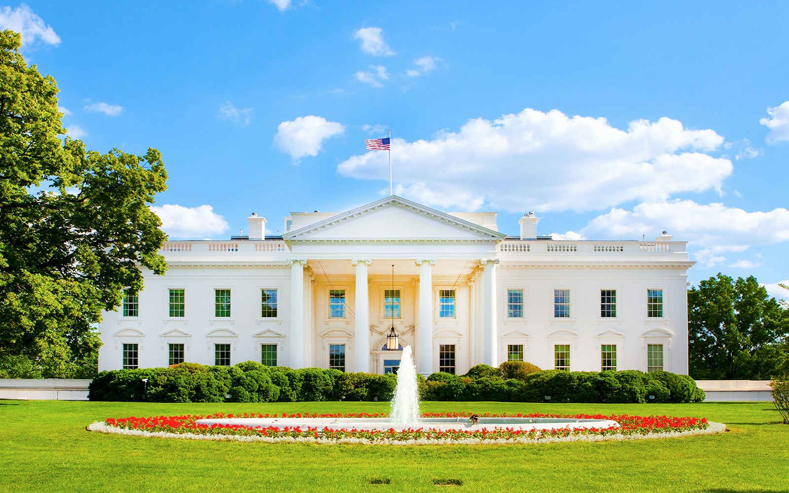 White House exterior with fountain and gardens, Washington DC.