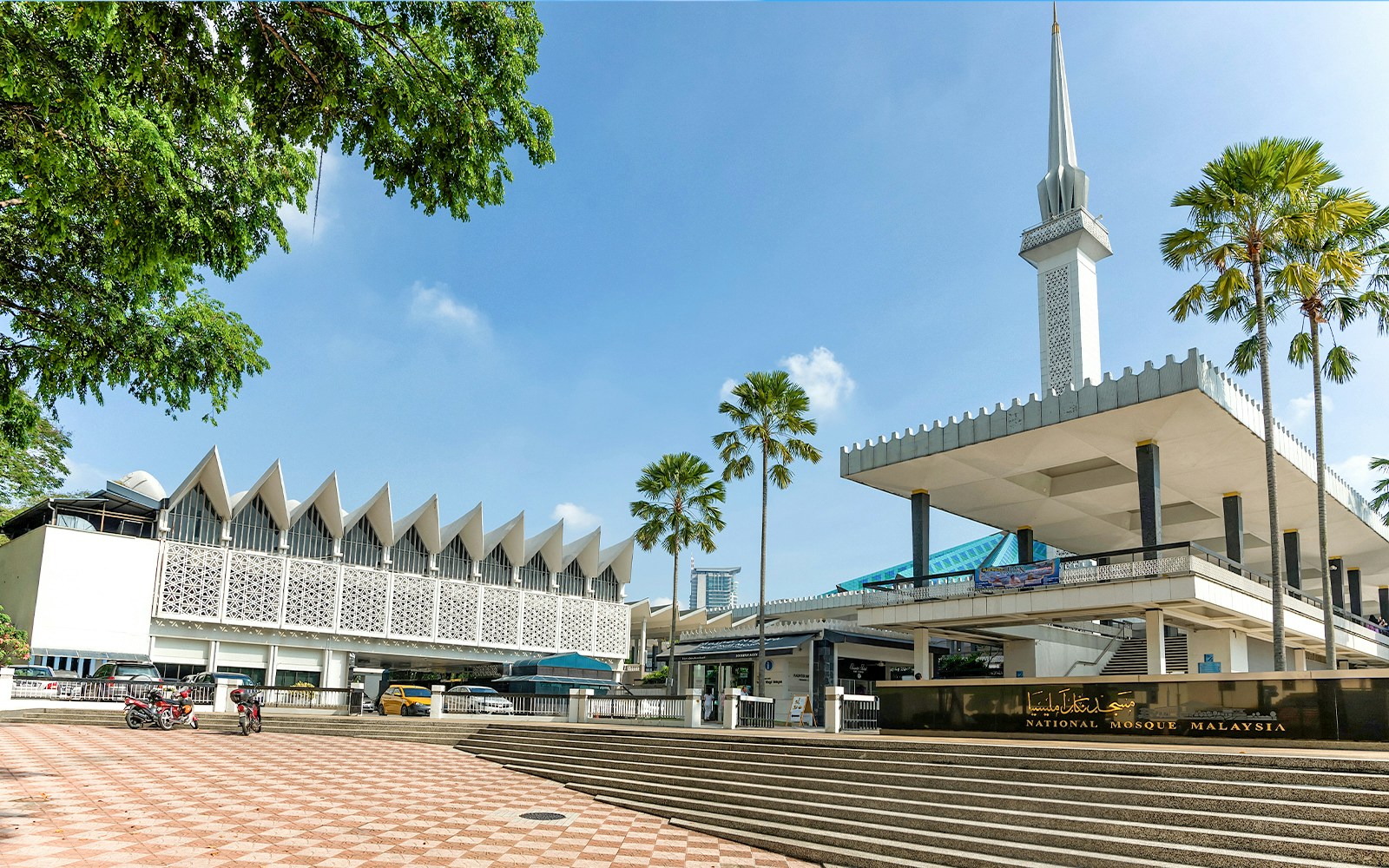 National Mosque of Malaysia with its iconic blue roof and minaret in Kuala Lumpur.