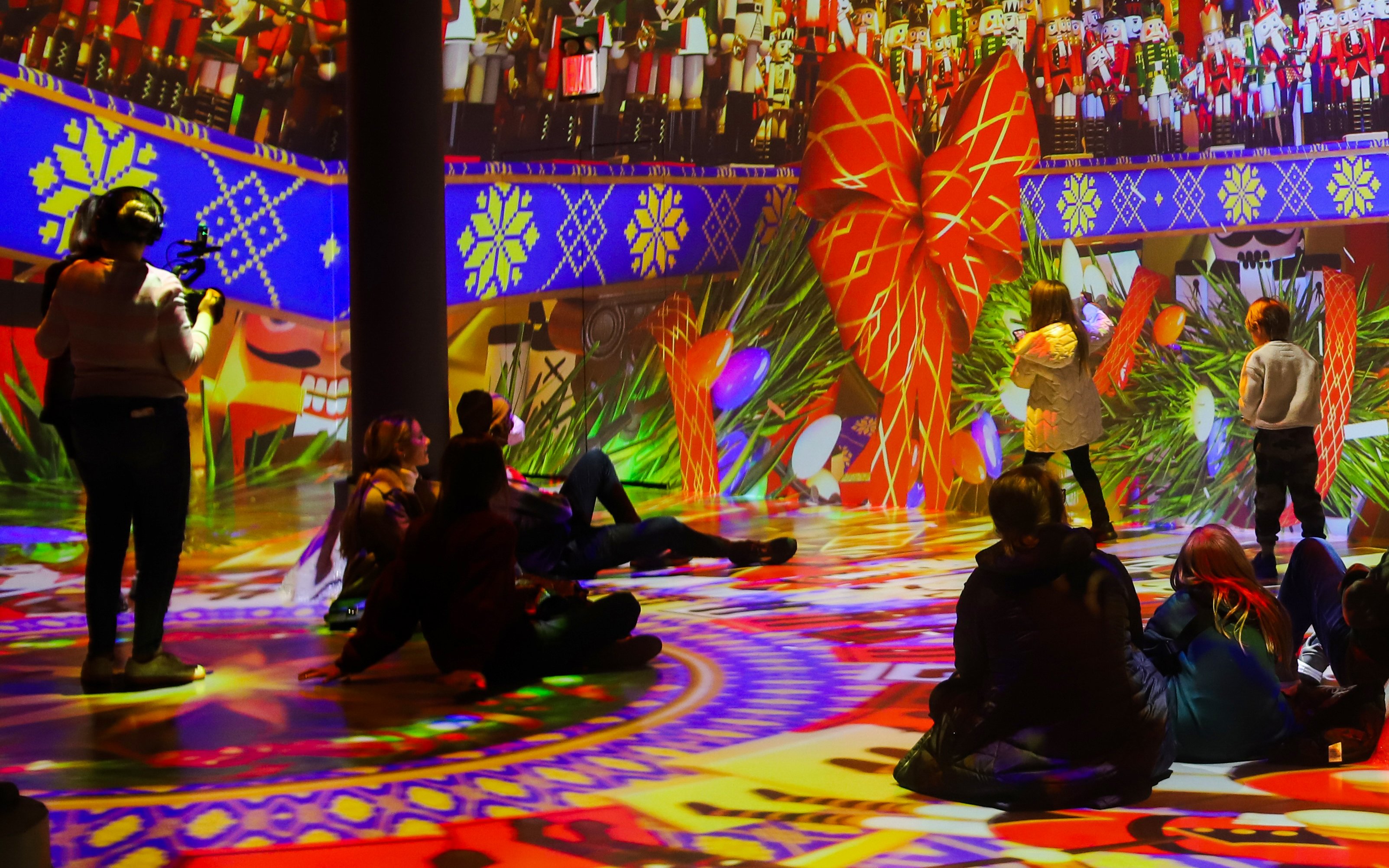 Visitors enjoying immersive digital art at ARTECHOUSE New York.