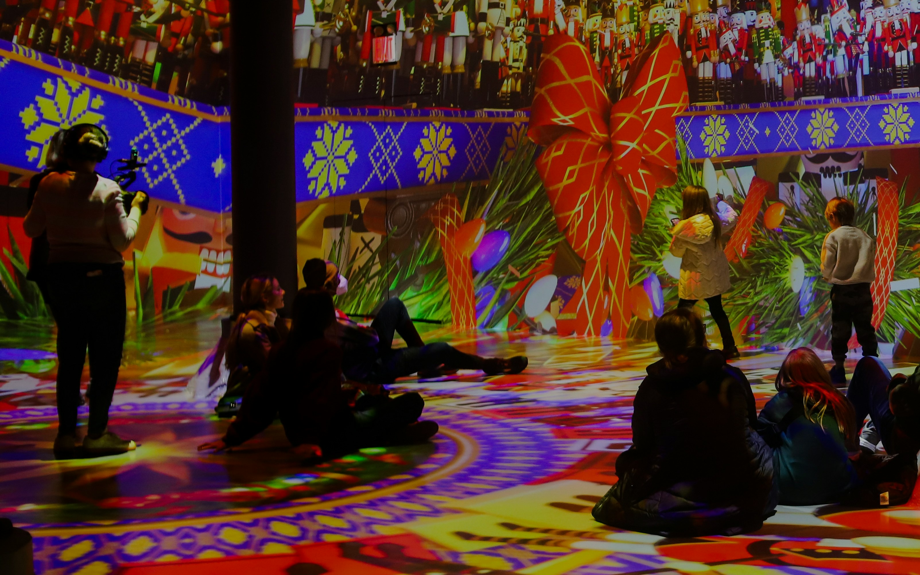 Visitors enjoying immersive digital art at ARTECHOUSE New York.