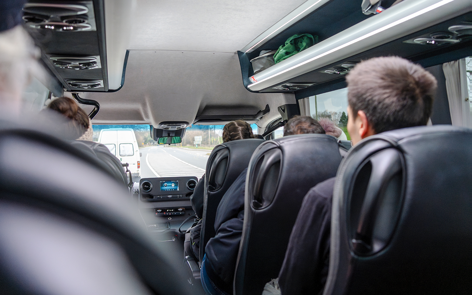 Minivan interior during Komani Lake and Shala River tour transfer from Tirana.