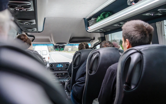 Minivan interior during Komani Lake and Shala River tour transfer from Tirana.